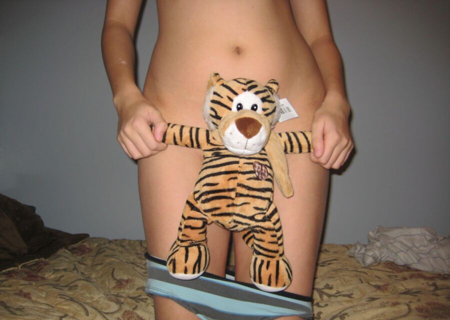 Teen girl playing with her tiger