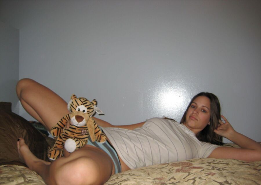 Teen girl playing with her tiger