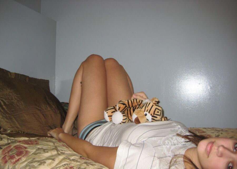 Teen girl playing with her tiger