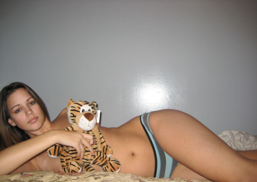 Teen girl playing with her tiger