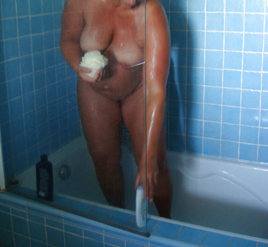 Pregnant wife showering