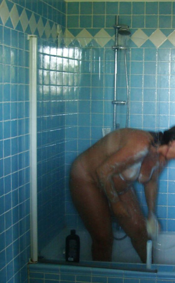 Pregnant wife showering