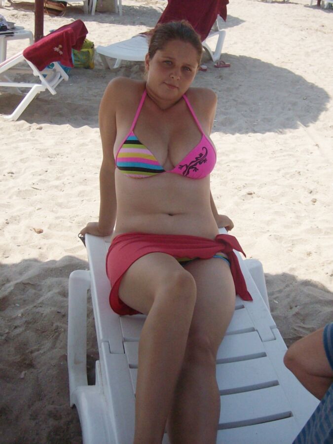 Chubby mother and her busty daughter on the beach