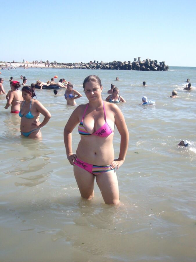 Chubby mother and her busty daughter on the beach