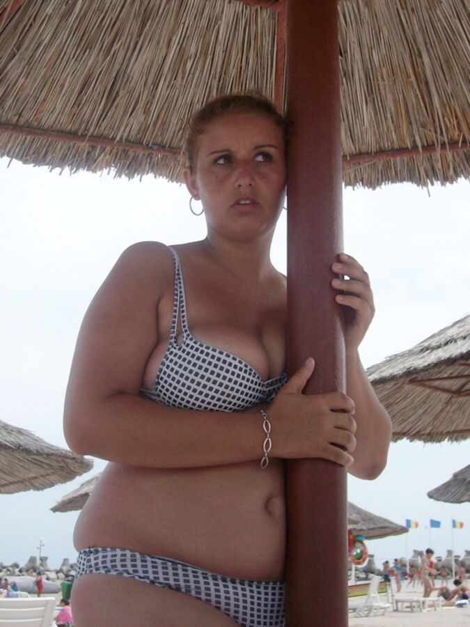 Chubby mother and her busty daughter on the beach