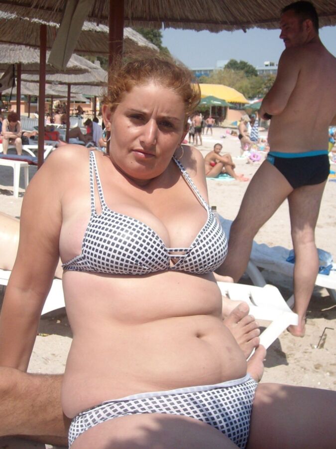 Chubby mother and her busty daughter on the beach