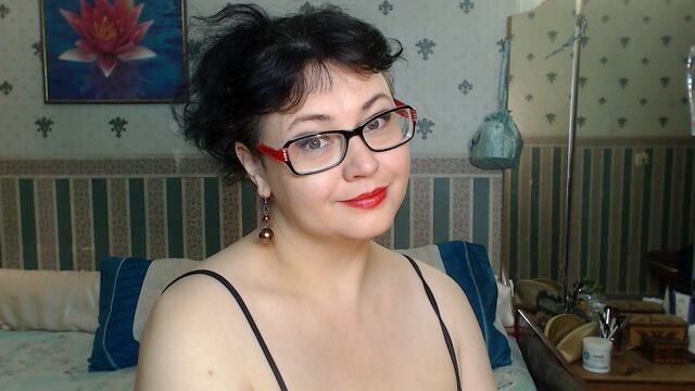 Brunette mature with big tits and glasses