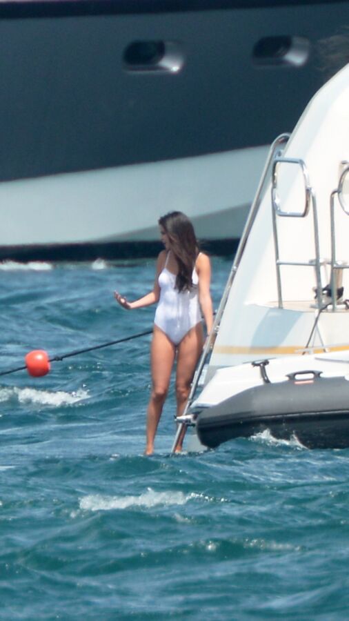 Selena Gomez poking through her one peice