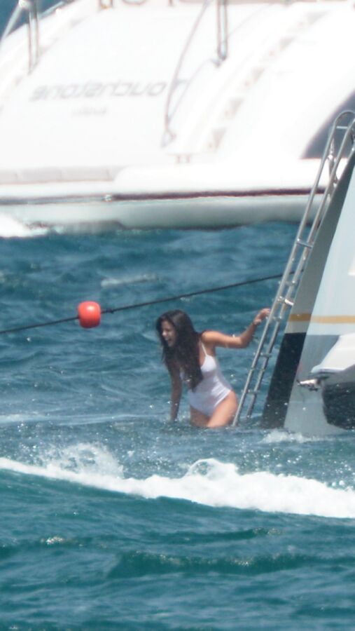 Selena Gomez poking through her one peice