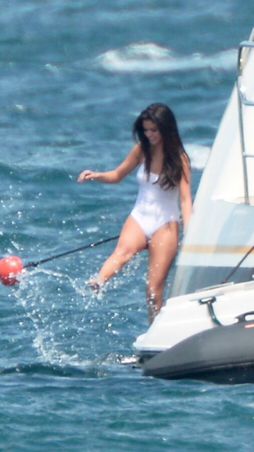 Selena Gomez poking through her one peice