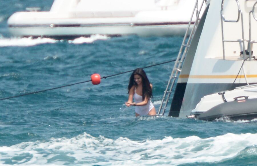 Selena Gomez poking through her one peice