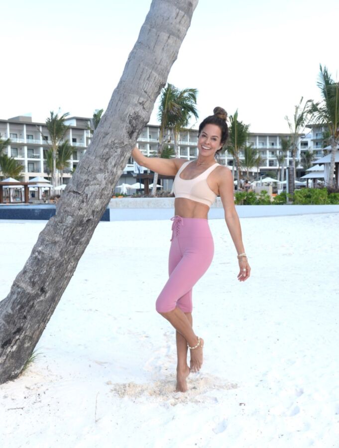 Brooke Burke doing yoga on the beach