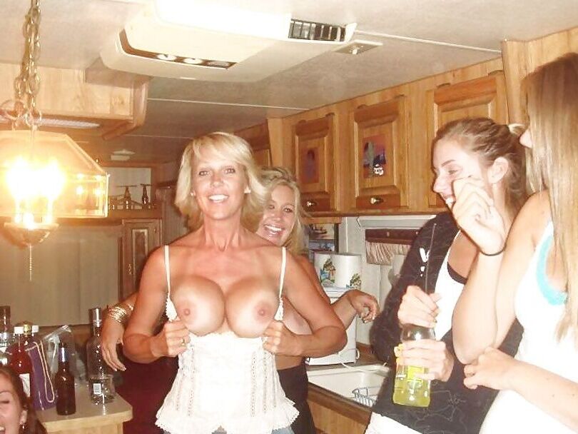 Milf flashing big tits at party