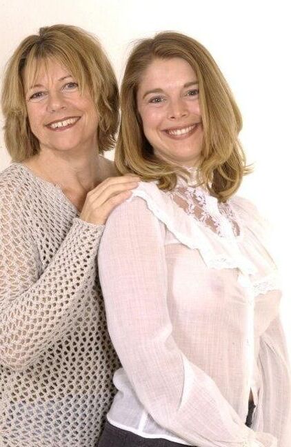 Mom and daughter posing in the studio