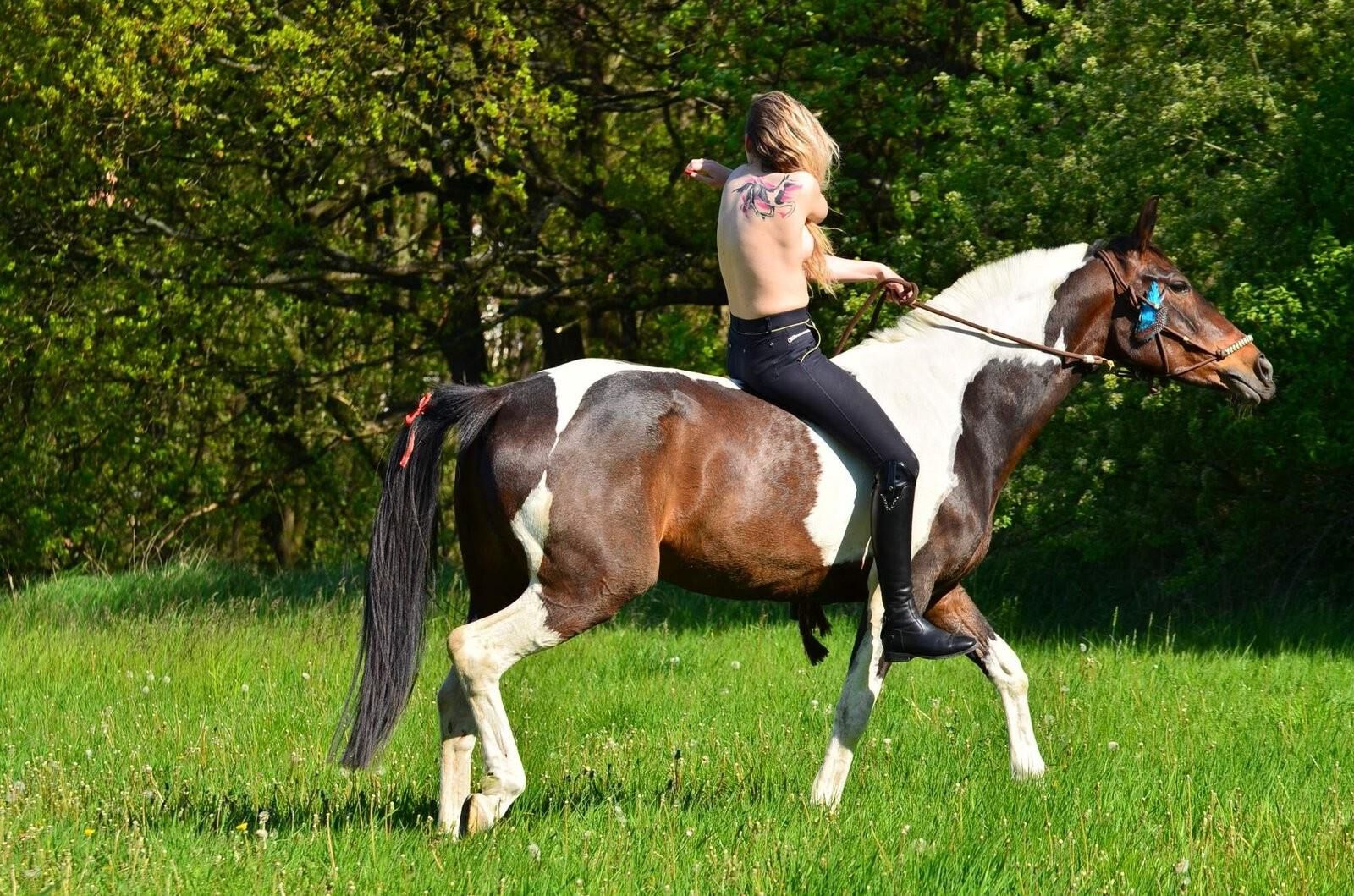 Girl riding her Horse Topless