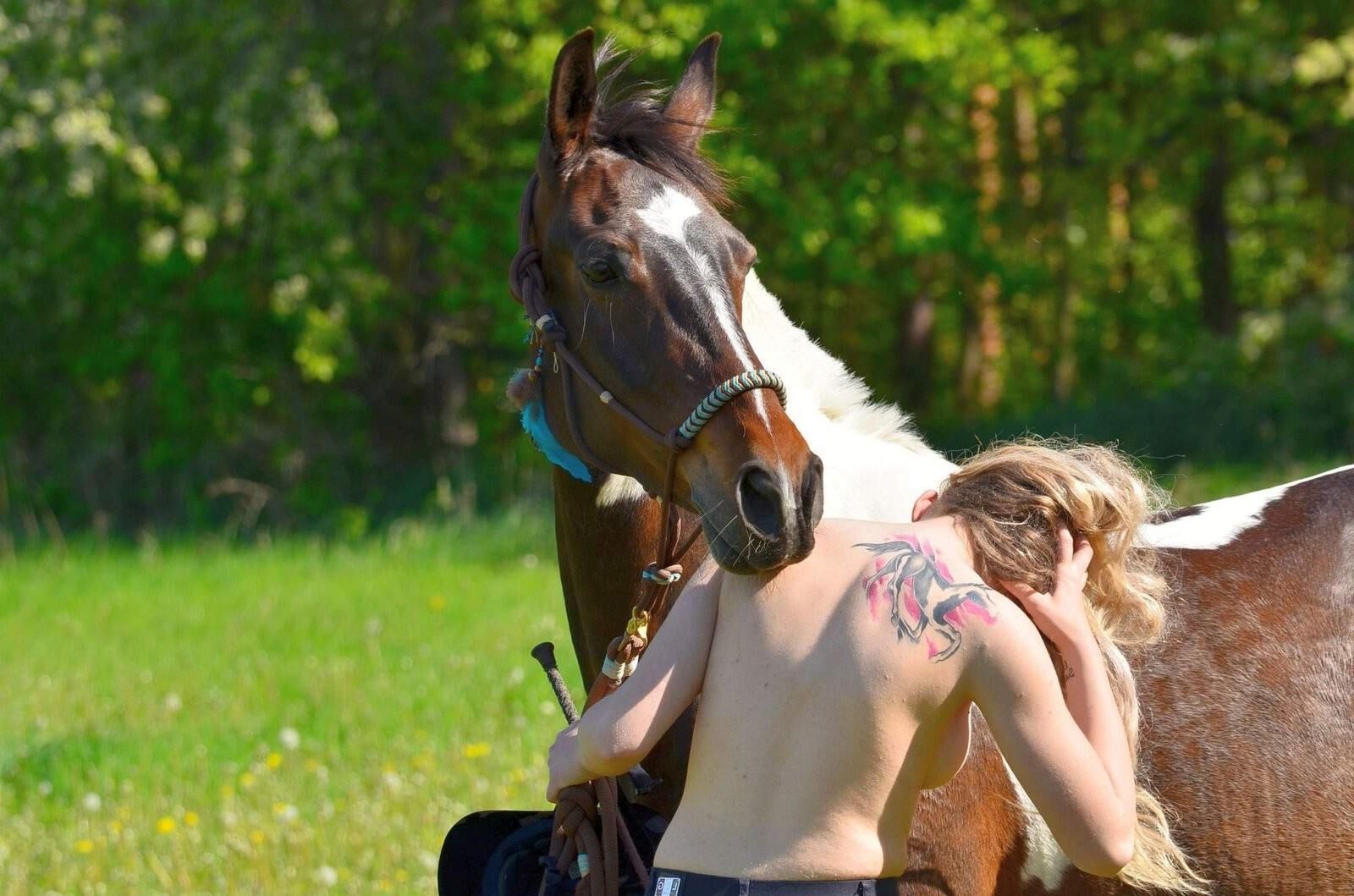 Girl riding her Horse Topless