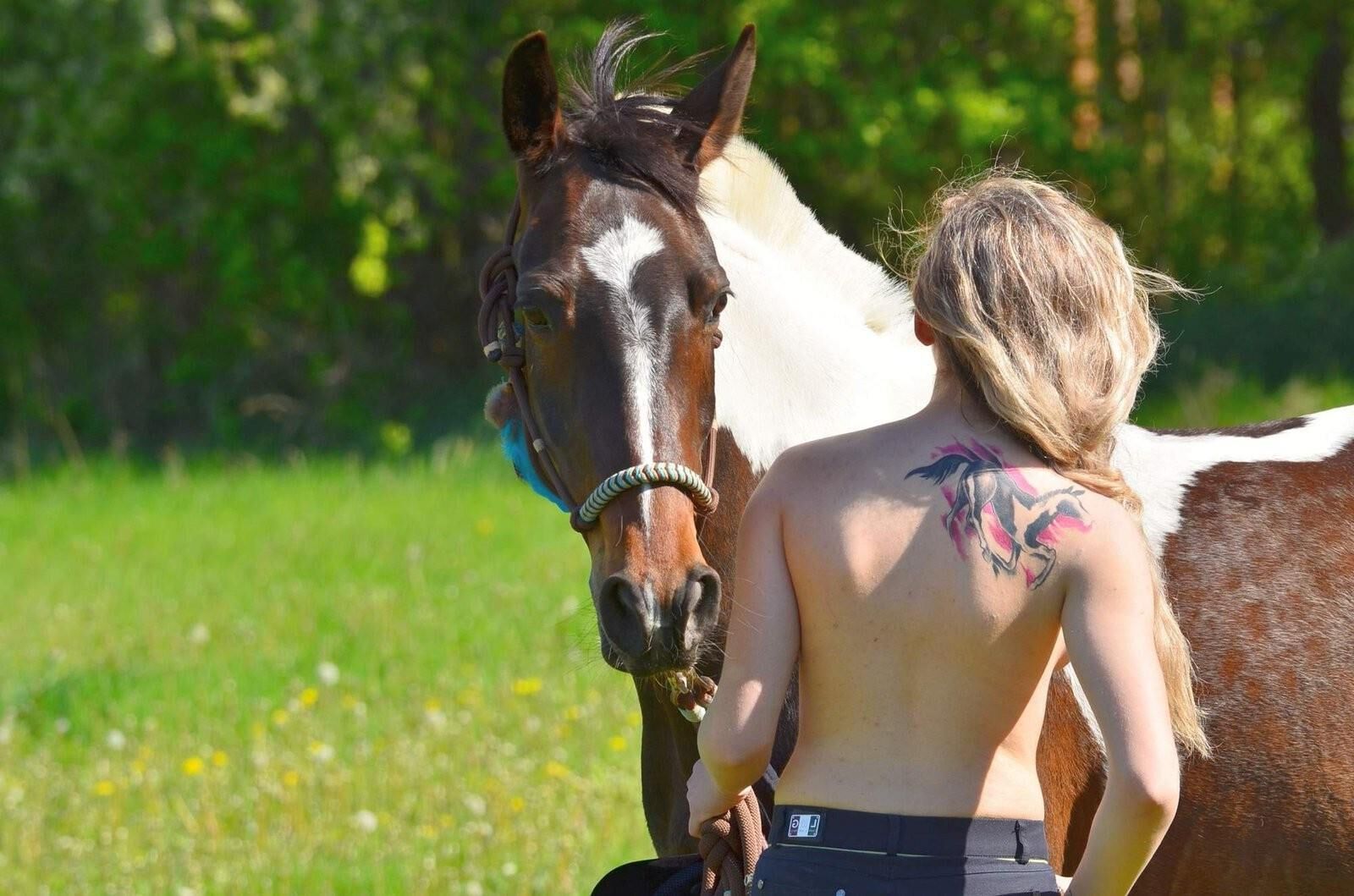 Girl riding her Horse Topless