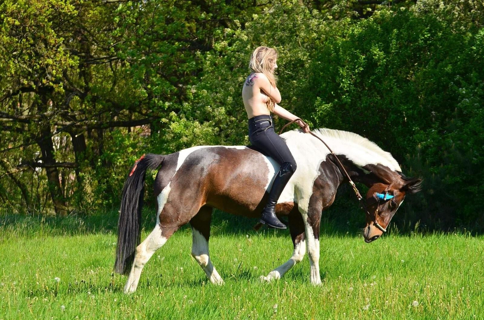 Girl riding her Horse Topless