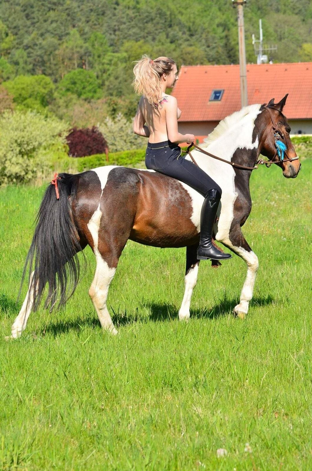 Girl riding her Horse Topless