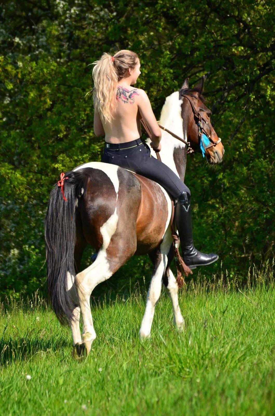 Girl riding her Horse Topless