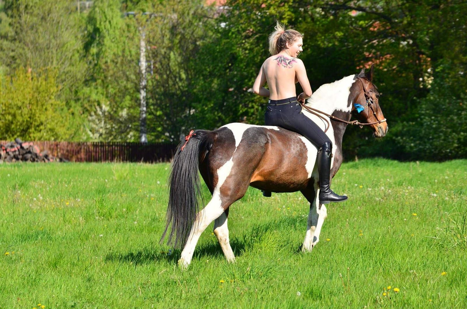 Girl riding her Horse Topless