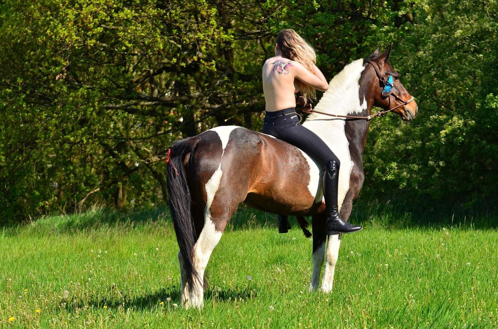 Girl riding her Horse Topless