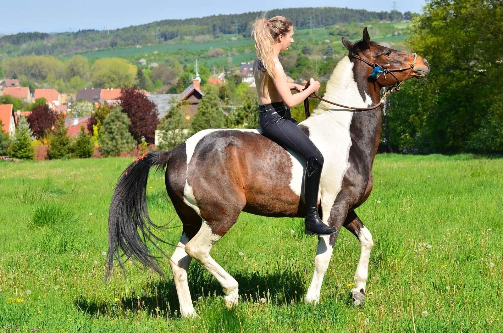 Girl riding her Horse Topless