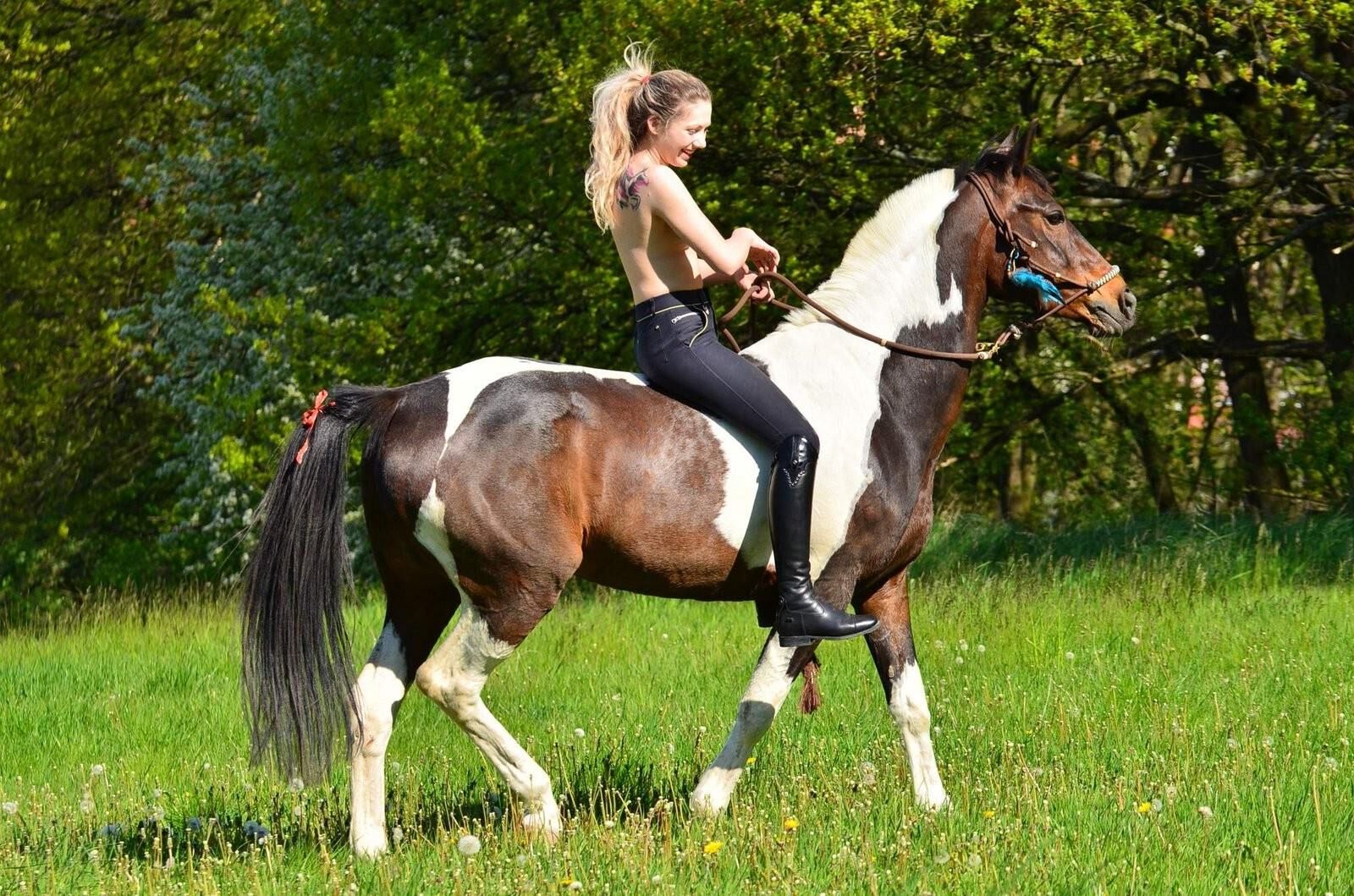 Girl riding her Horse Topless