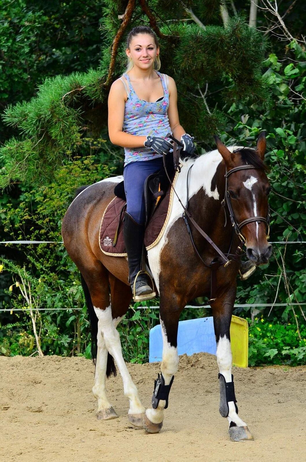 Girl riding her Horse Topless