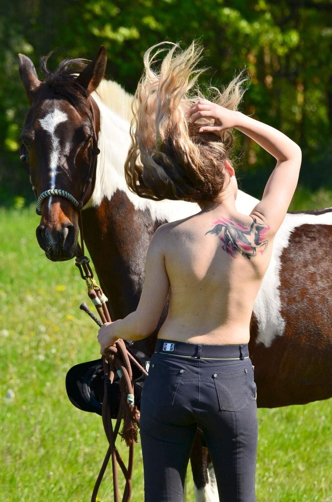 Girl riding her Horse Topless