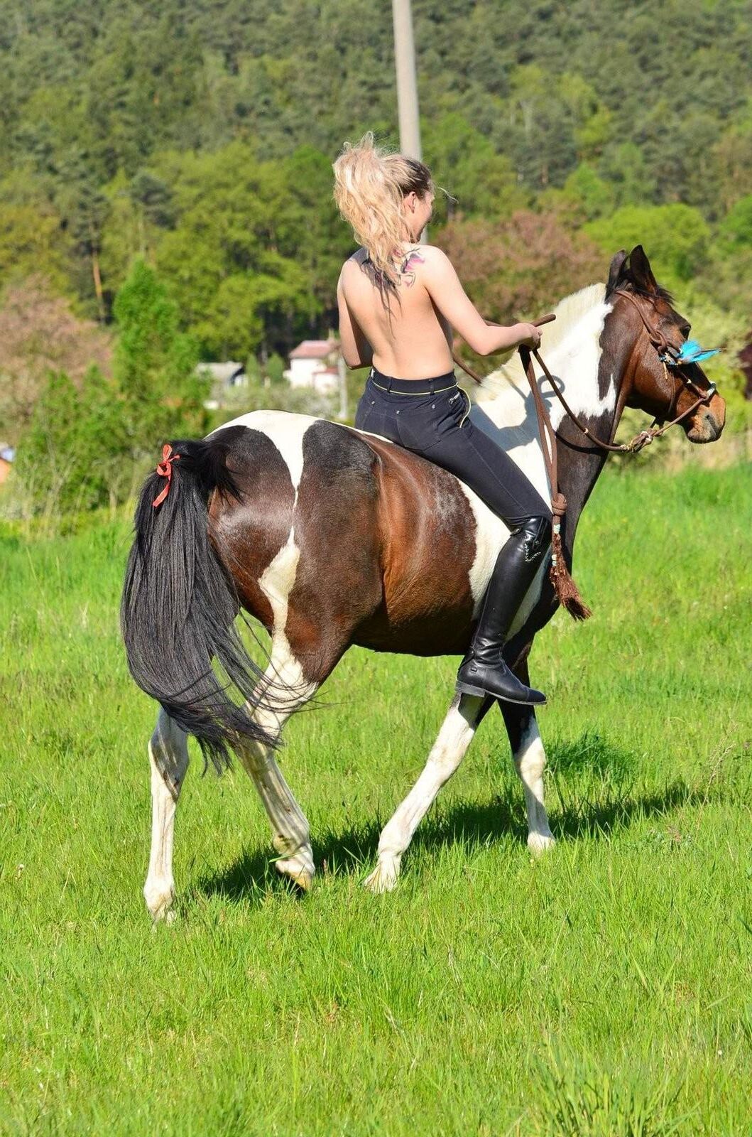 Girl riding her Horse Topless