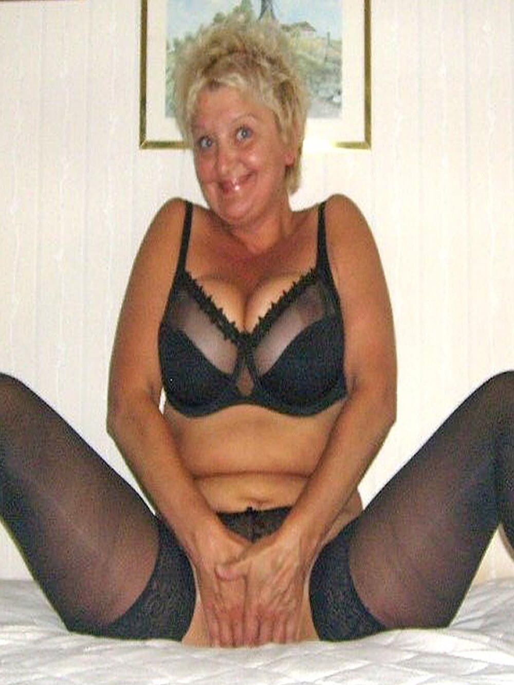 Posing in black lingerie