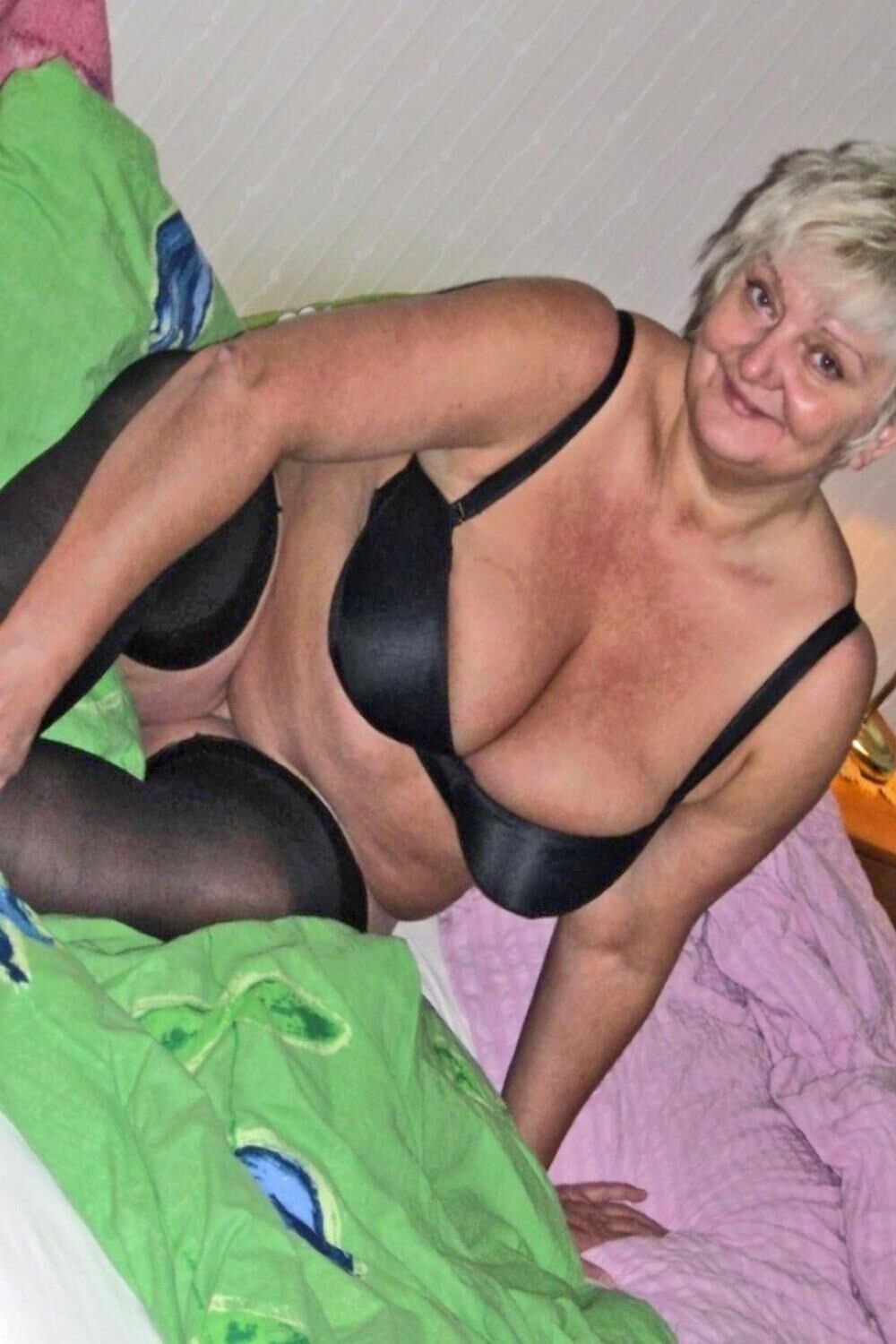 Posing and masturbating