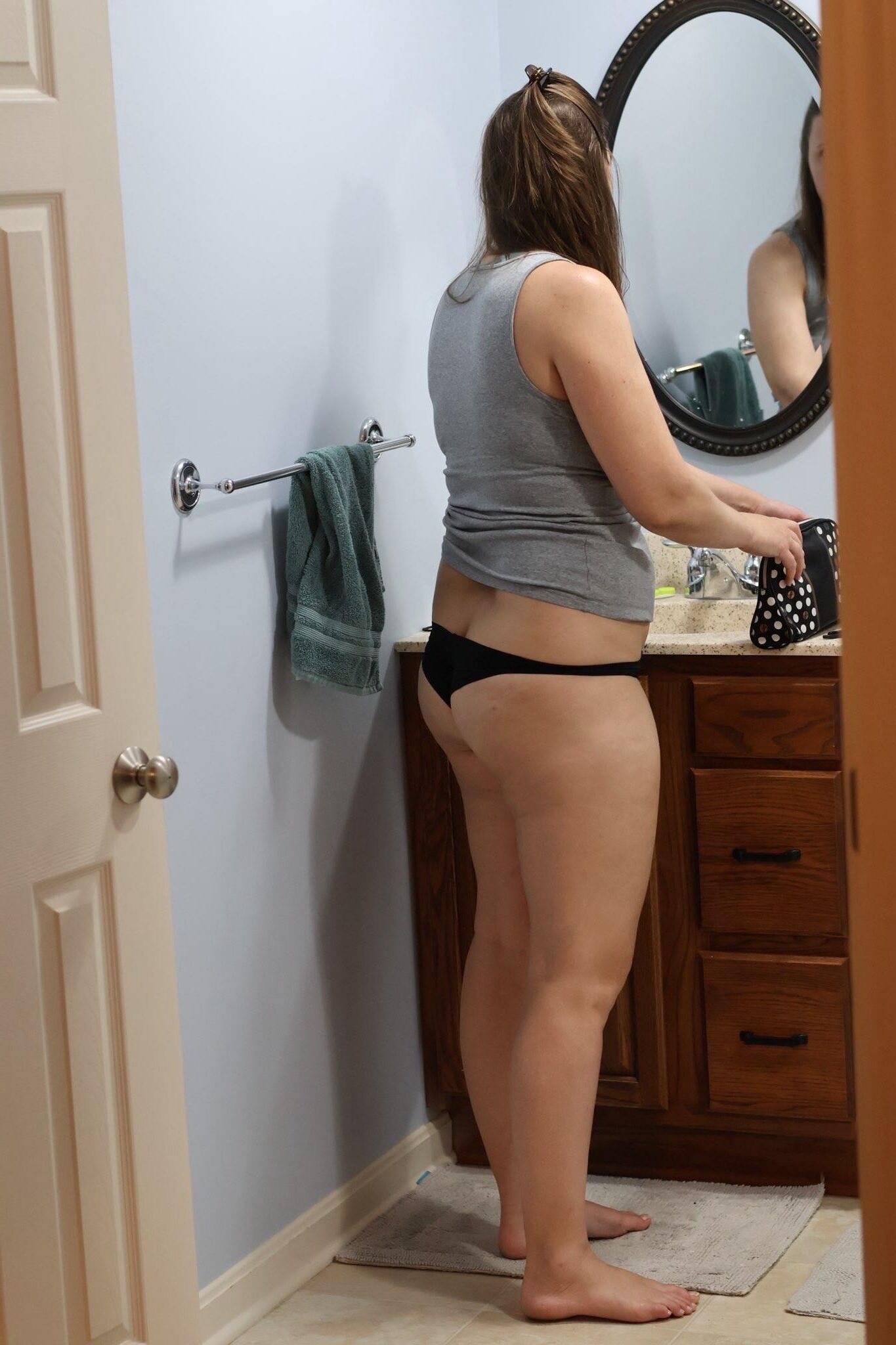 Wife getting ready to go out to dinner and a concert. 